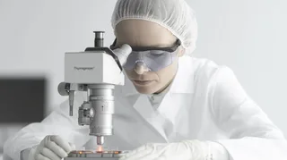 a-man-in-a-white-lab-coat-working-at-a-computer-viewing-a-3d-model-on-the-screen-in-a-laboratory-or-office-setting-22.png