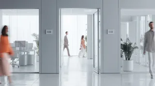 modern-office-interior-with-glass-walls-wooden-accents-and-a-person-walking-up-a-staircase-in-motion-blur-1.png